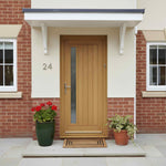 Wooden front door with glass panel on a brick house exterior