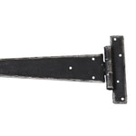 Product A single black metal barn door hinge with a long triangular blade and a square mounting bracket, shown on a plain white background.