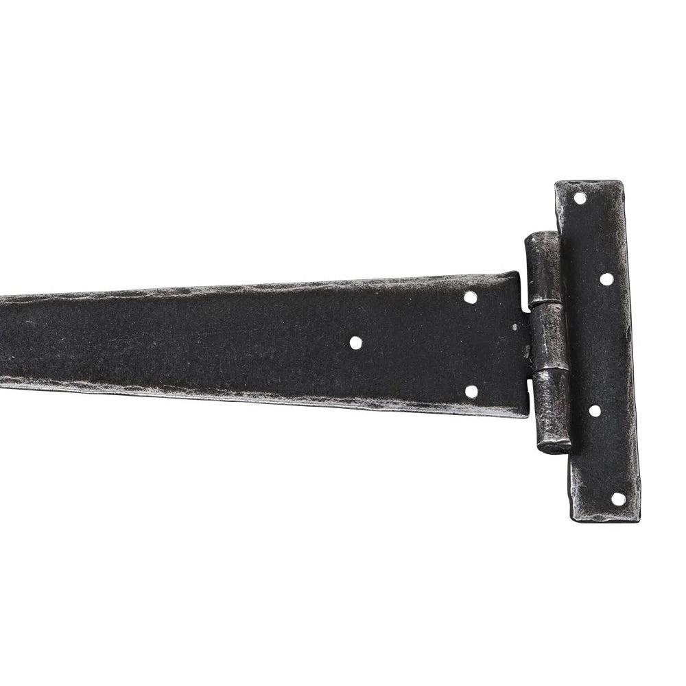 Product A single black metal barn door hinge with a long triangular blade and a square mounting bracket, shown on a plain white background.