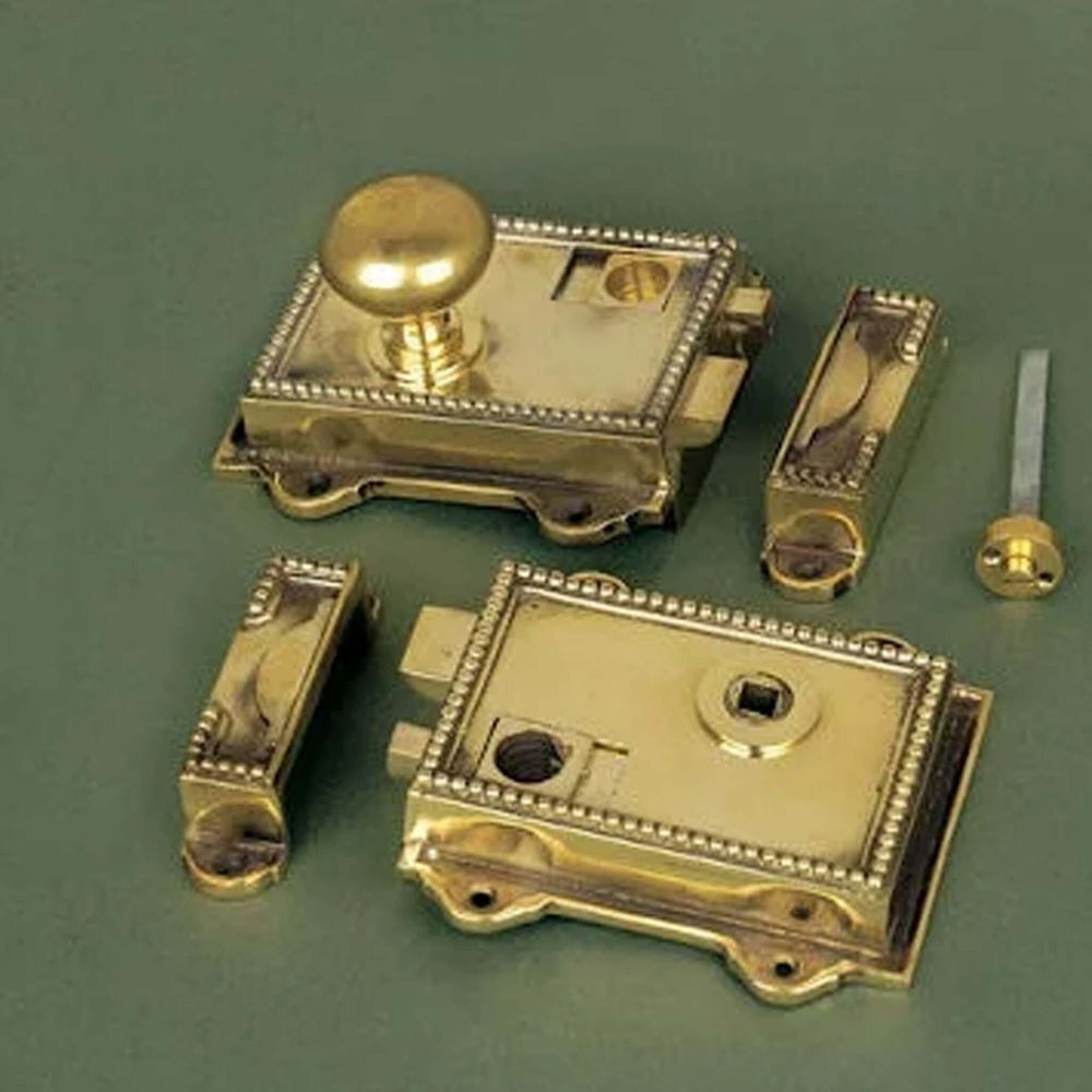 Product polished brass regency rim latch and keeps