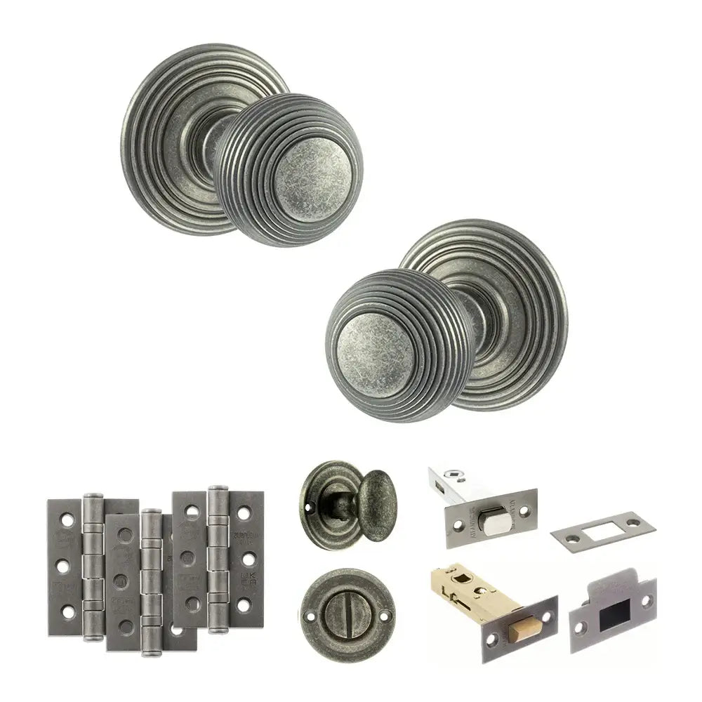 Pair of Ripon reeded beehive knobs in distressed silver with hinges, thumbturn and bathroom deadbolt