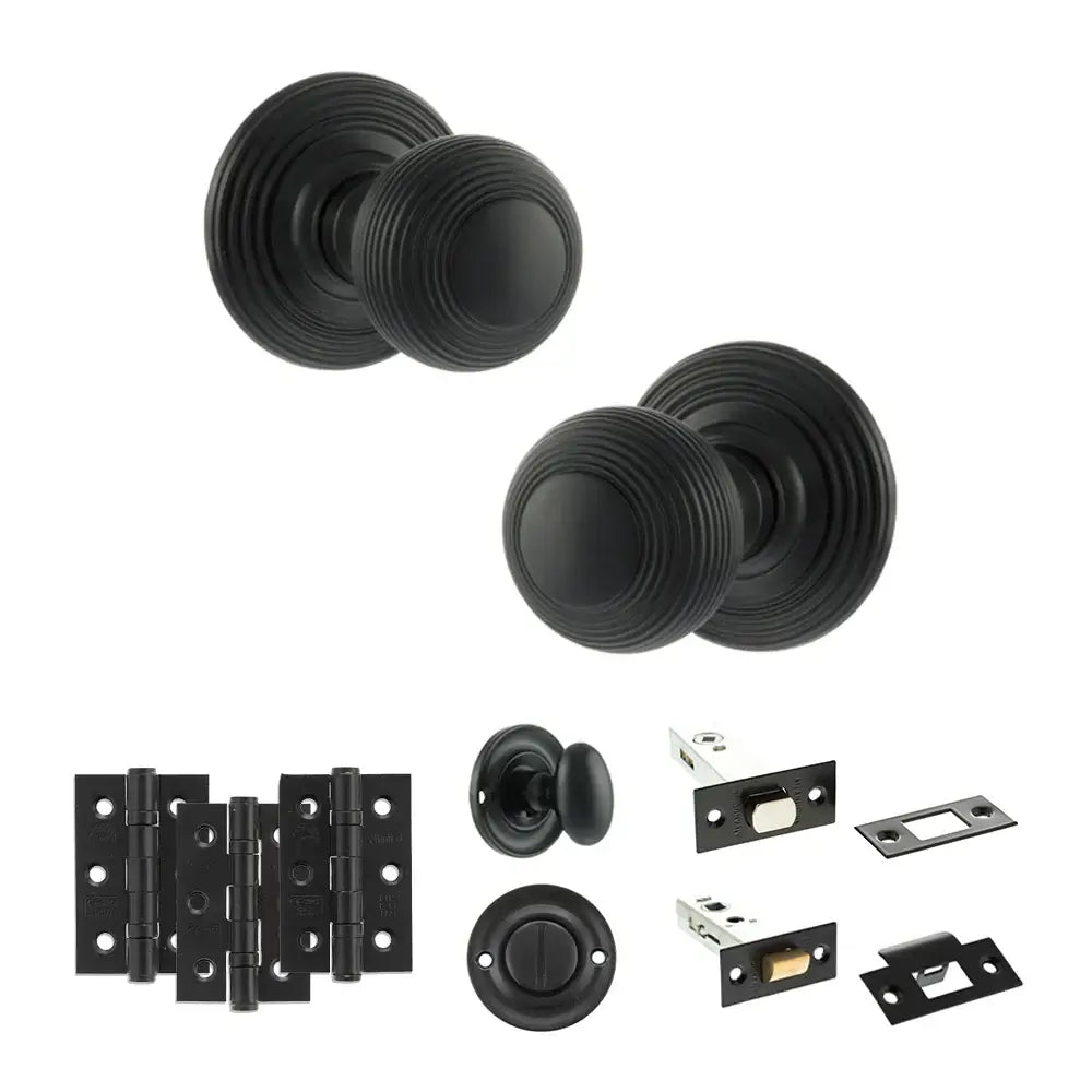 Pair of Ripon reeded beehive knobs in matt black with hinges, thumbturn and bathroom deadbolt