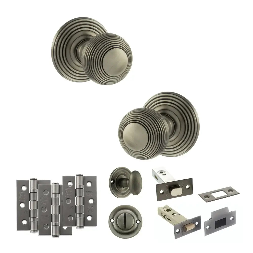 Pair of Ripon reeded beehive knobs in matt gunmetal with hinges, thumbturn and deadbolt