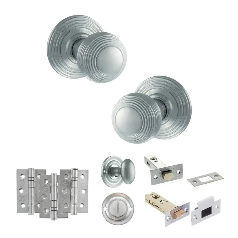 Pair of Ripon reeded beehive knobs in satin chrome with hinges, thumbturn and bathroom deadbolt