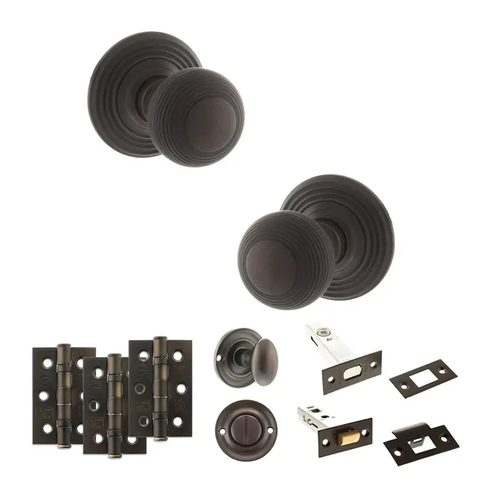 Pair of Ripon reeded beehive knobs in dark urban bronze with hinges and deadbolt