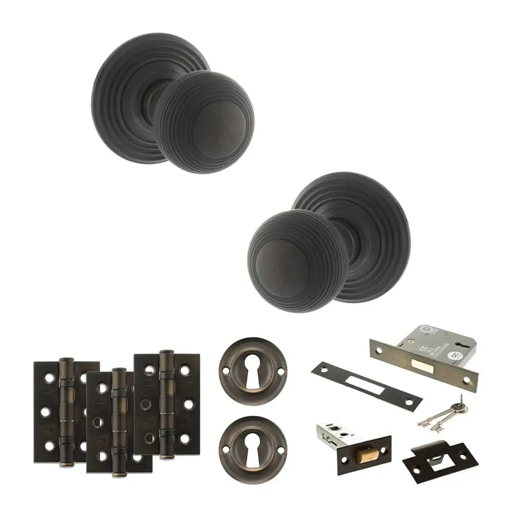 Pair of Ripon reeded beehive knobs in dark urban bronze with sash lock and keys