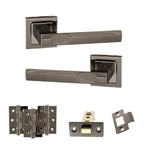 Product Set of metallic door handles and hardware components on a white background