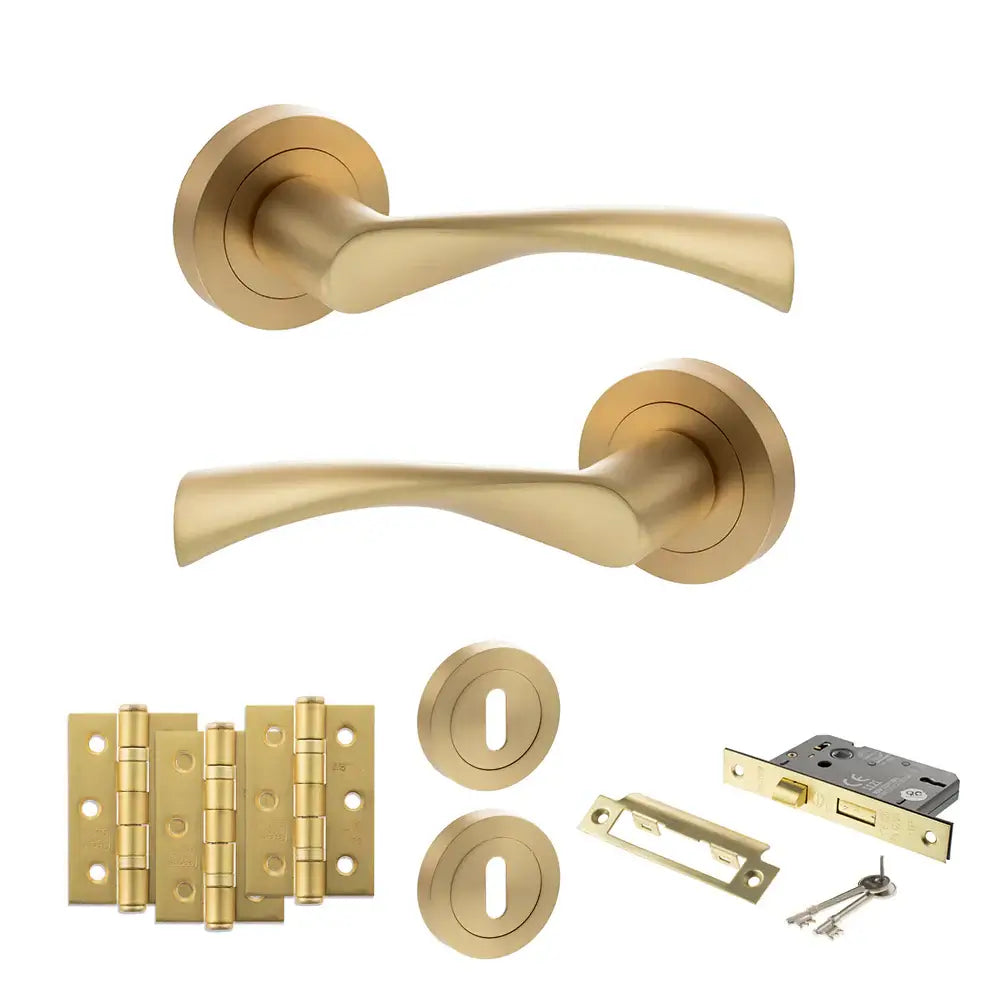 Product Gold door handle set with additional hardware components on a white background