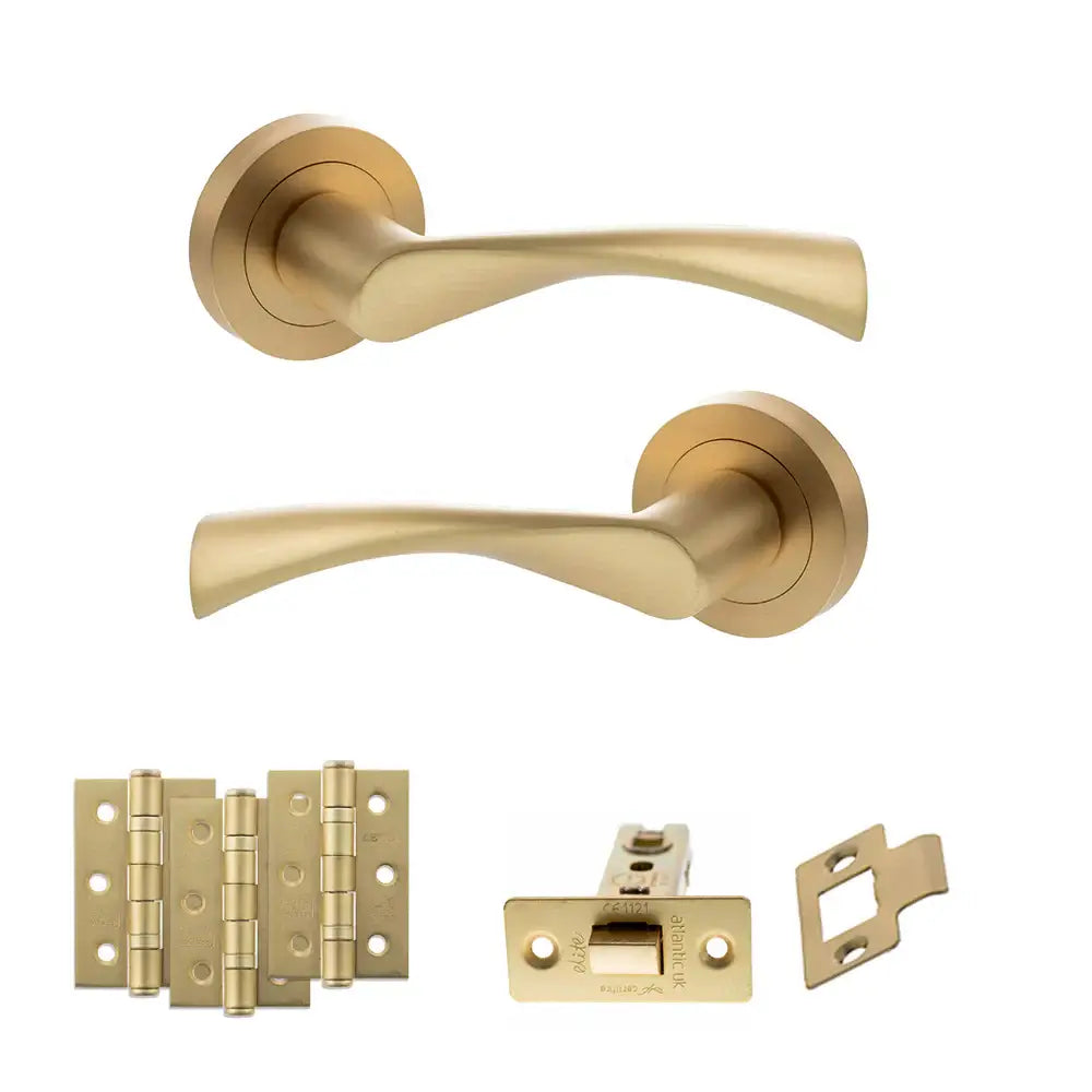 Product Set of gold door handles and hardware components on a white background