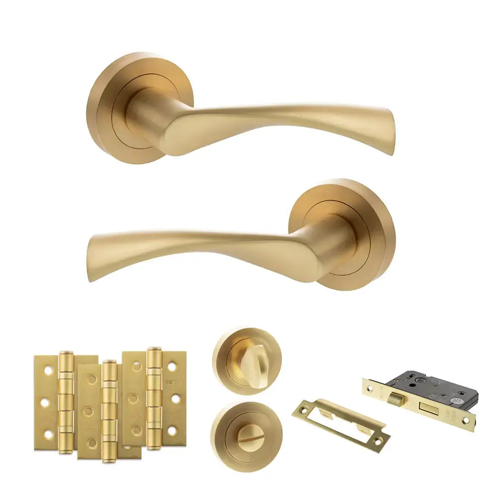 Product Set of gold door handles and hardware components on a white background