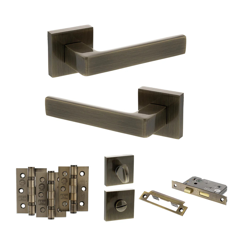Product Set of bronze door handles and hardware components on a white background