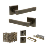 Product Set of bronze door handles and hardware components on a white background