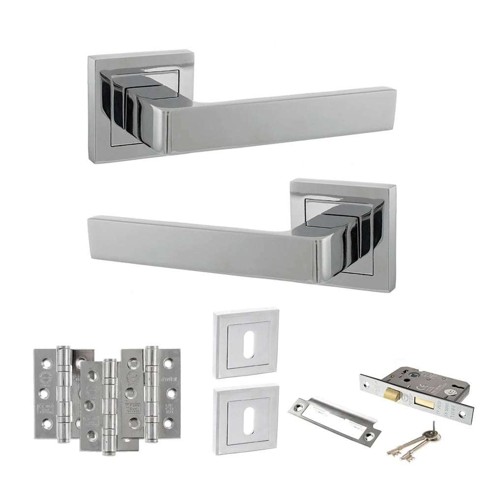 Product Set of chrome door handles, hinges, and lock on a white background