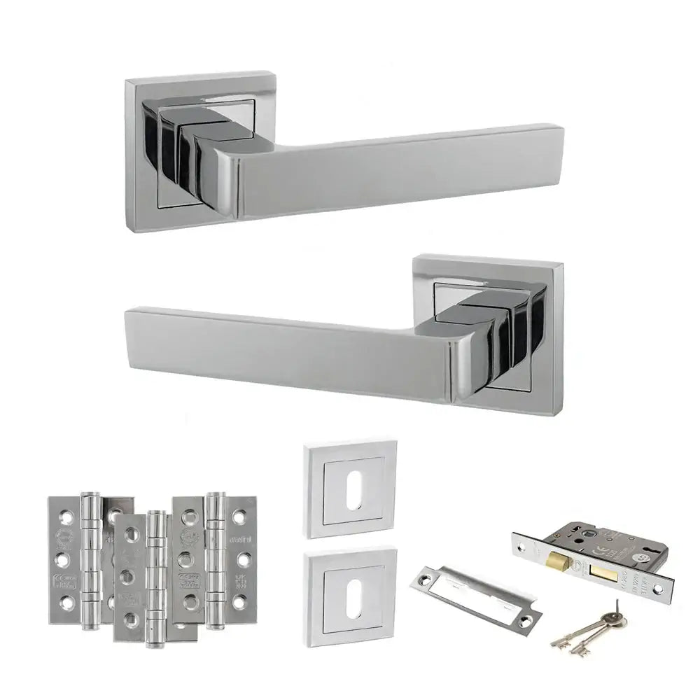Product Set of chrome door handles, hinges, and lock on a white background