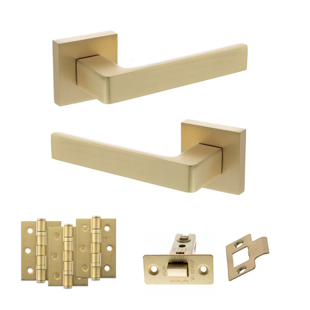 Product Set of gold door handles and hardware components on a white background
