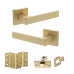 Product Set of gold door handles and hardware components on a white background