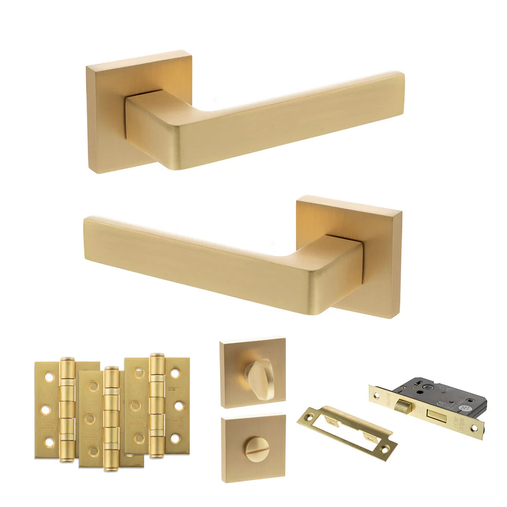 Product Collection of gold door handles and hardware on a white background