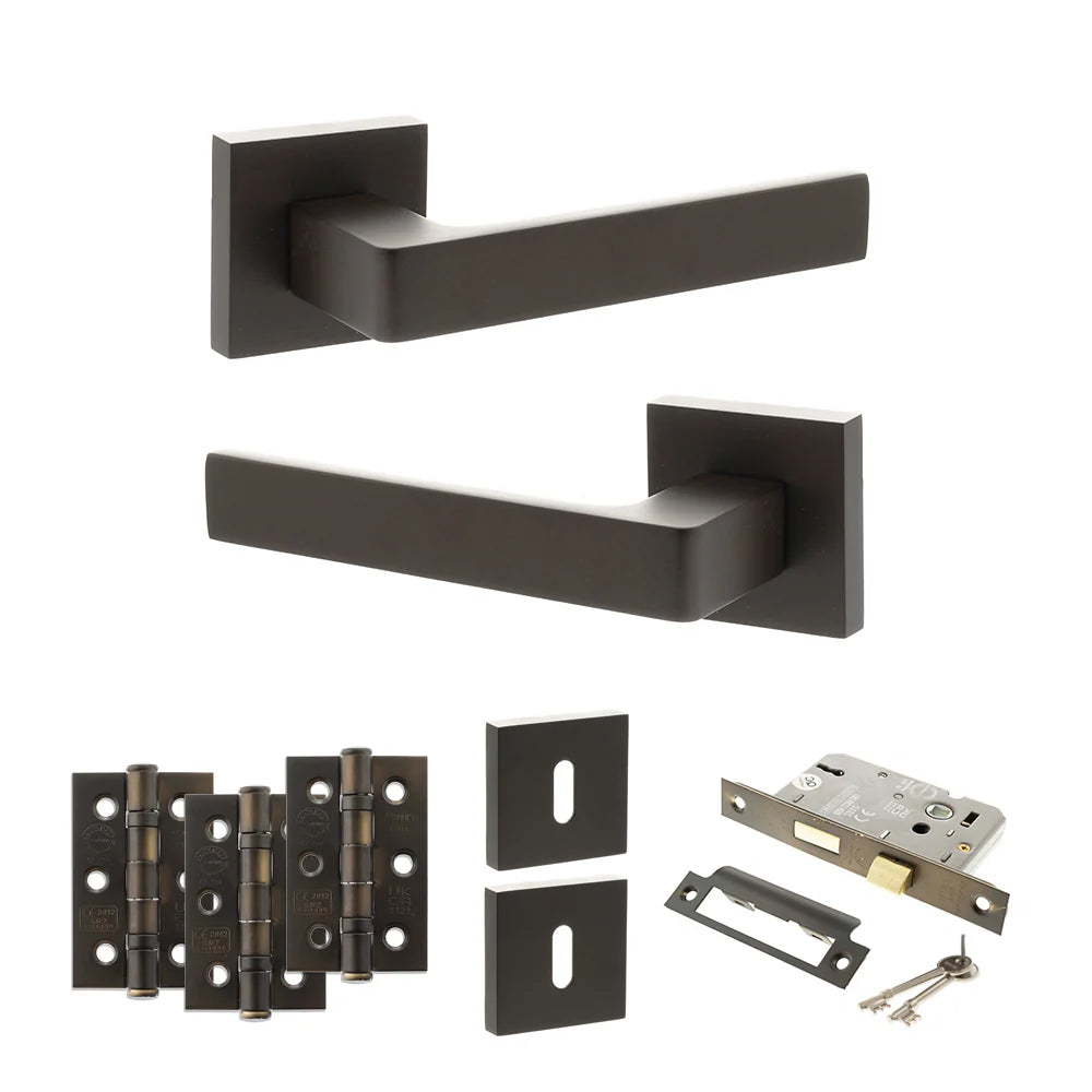 Product Set of black door handles, hinges, and lock mechanism on a white background