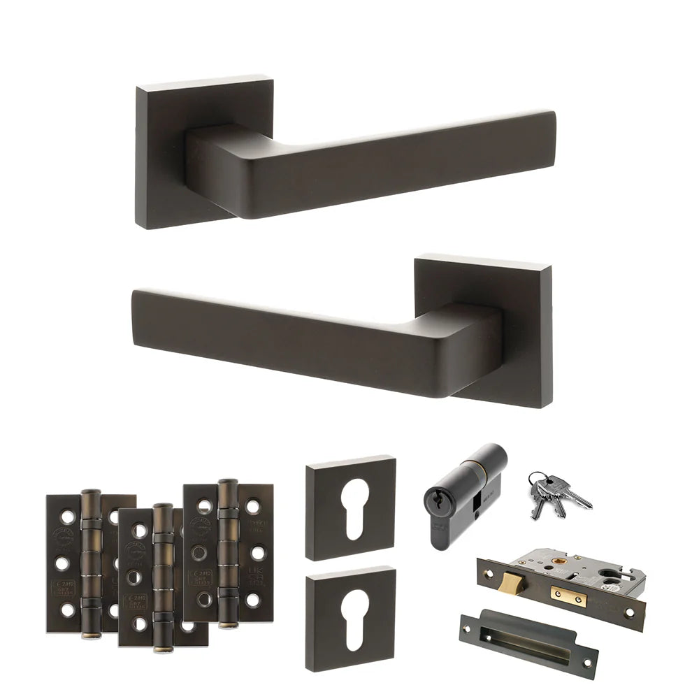Product Set of black door handles, hinges, and lock components on a white background