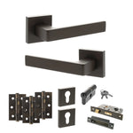Product Set of black door handles, hinges, and lock components on a white background