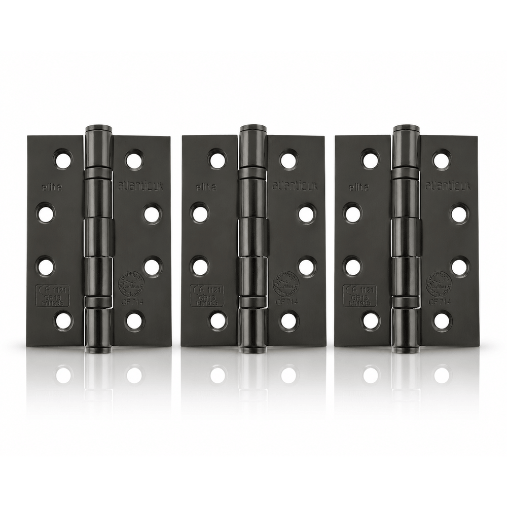 Product Three black metal hinges arranged side by side on a white reflective surface.