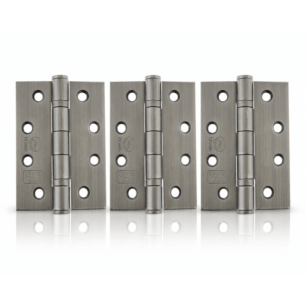 Product Three brushed metal hinges arranged side by side on a clean white background with a subtle reflection below.