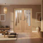 oak prefinished coventry vertical 3 glass panel interior door with glass panels in a modern room setting.