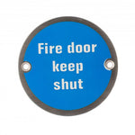Product A round blue fire door keep shut sign with white text and a dark metal border, shown on a plain white background.