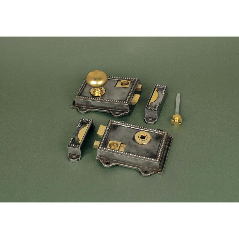 Product iron Victorian rim latch set with brass knobs