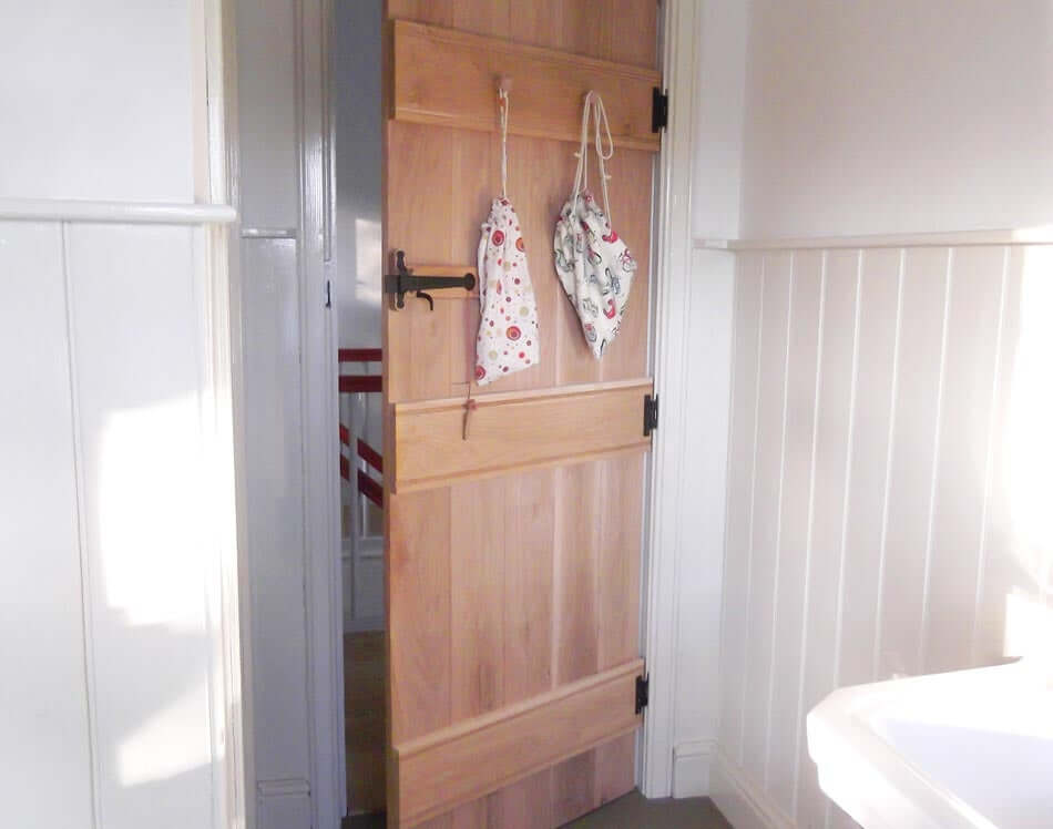 Lifestyle ledged barn hidden fixings oak door installed in room