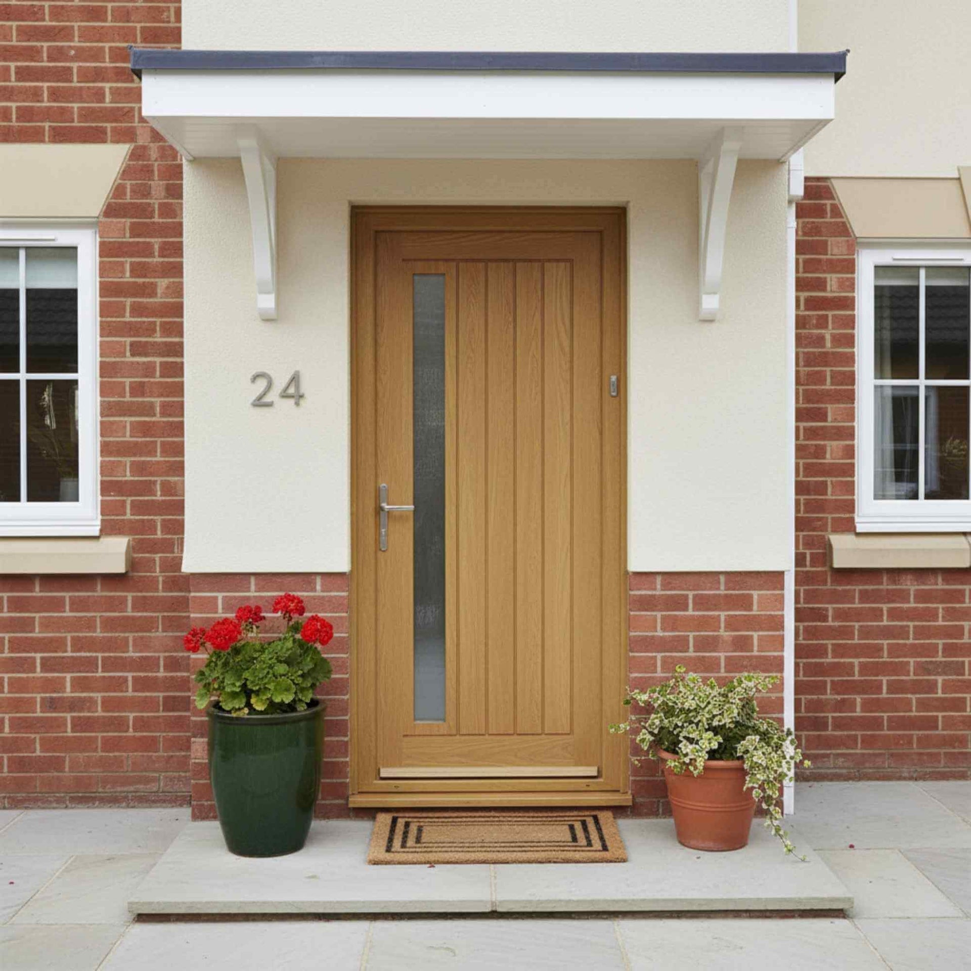 Wooden front door with glass panel on a brick house exterior