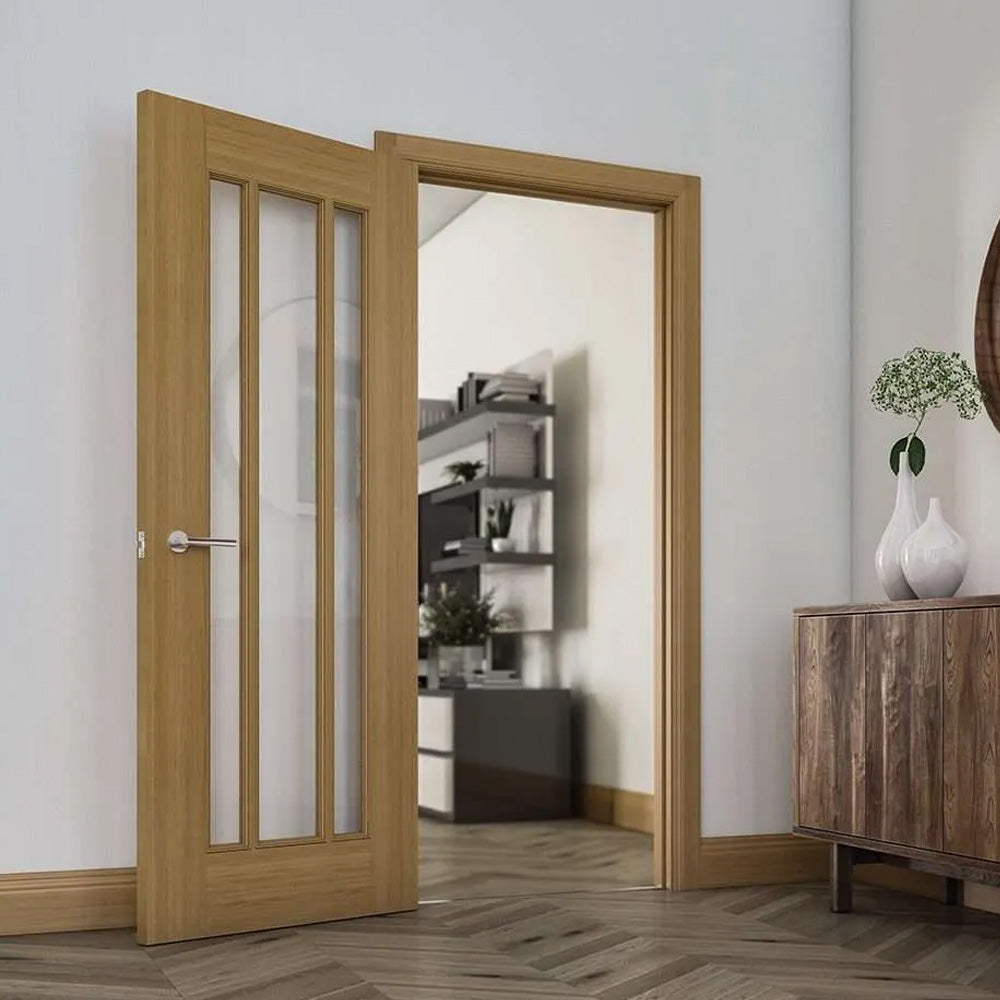 Wooden interior door with glass panels in a room with a wooden cabinet and decorative items.