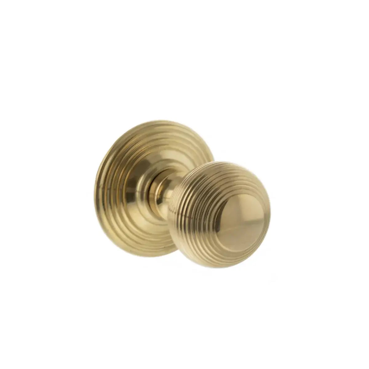 Single Ripon reeded beehive mortice knob on reeded rose in unlacquered raw brass