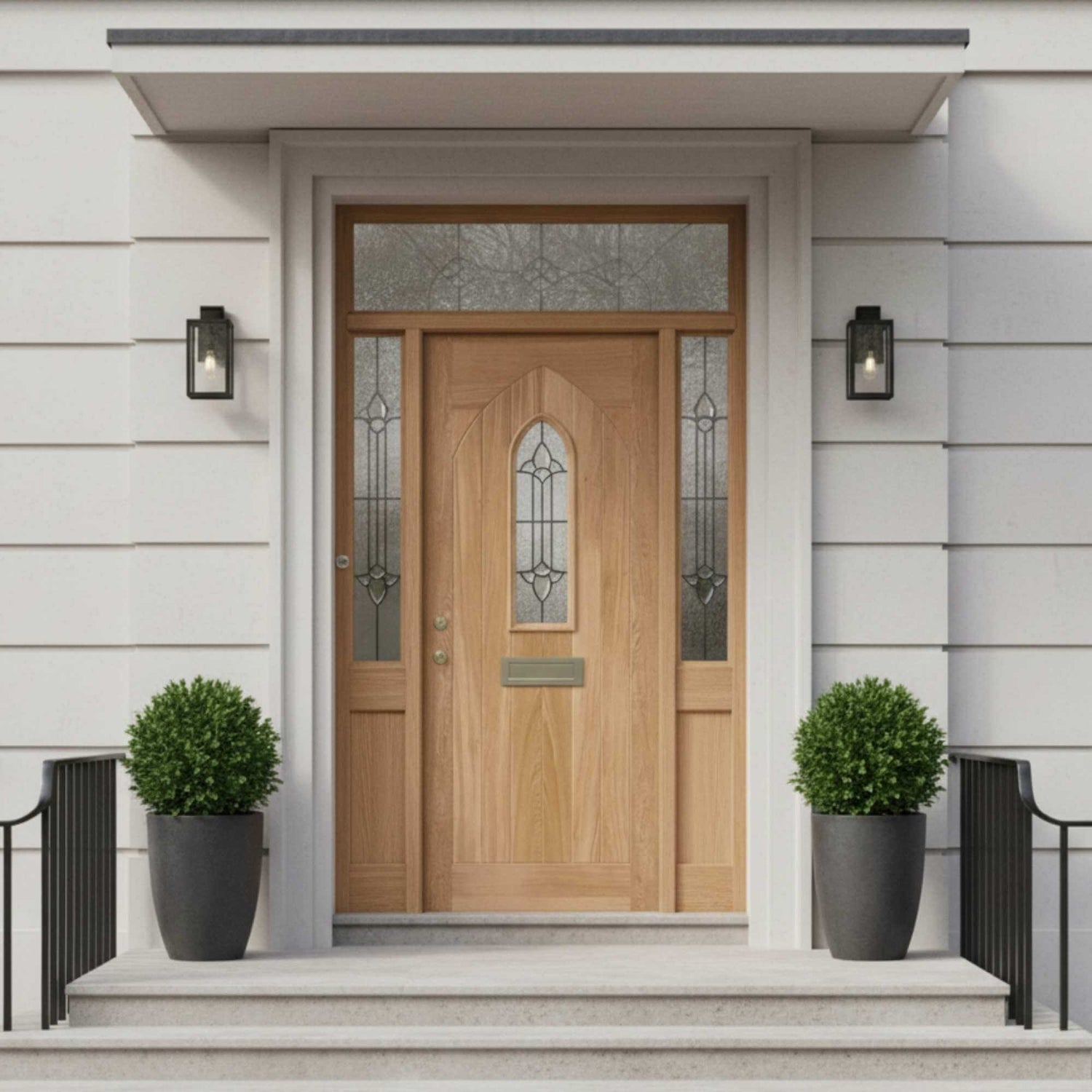 Wooden front door with decorative glass panels on a light gray house exterior.