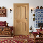 Traditional room with wooden door, tiled fireplace, and decorative elements.