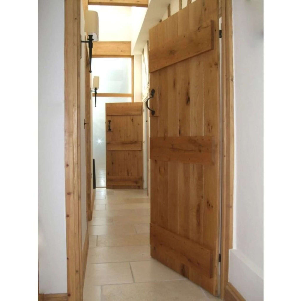 Lifestyle solid oak barn door shown in an interior setting