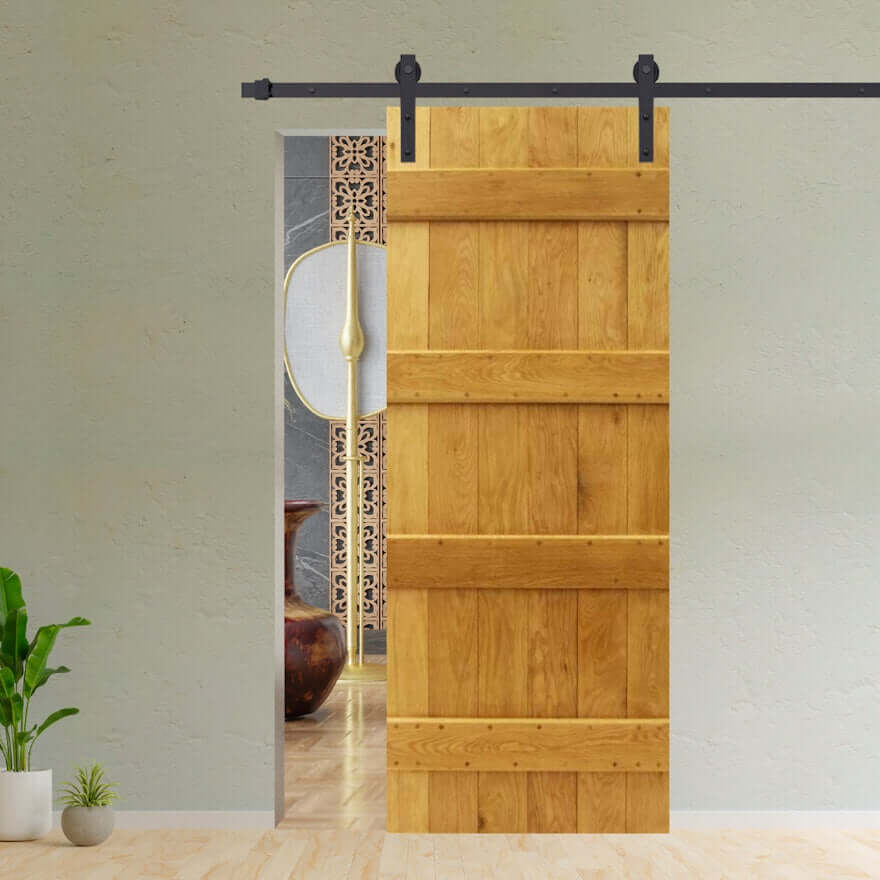 Lifestyle solid oak four-ledge single sliding barn door kit installed in a room setting