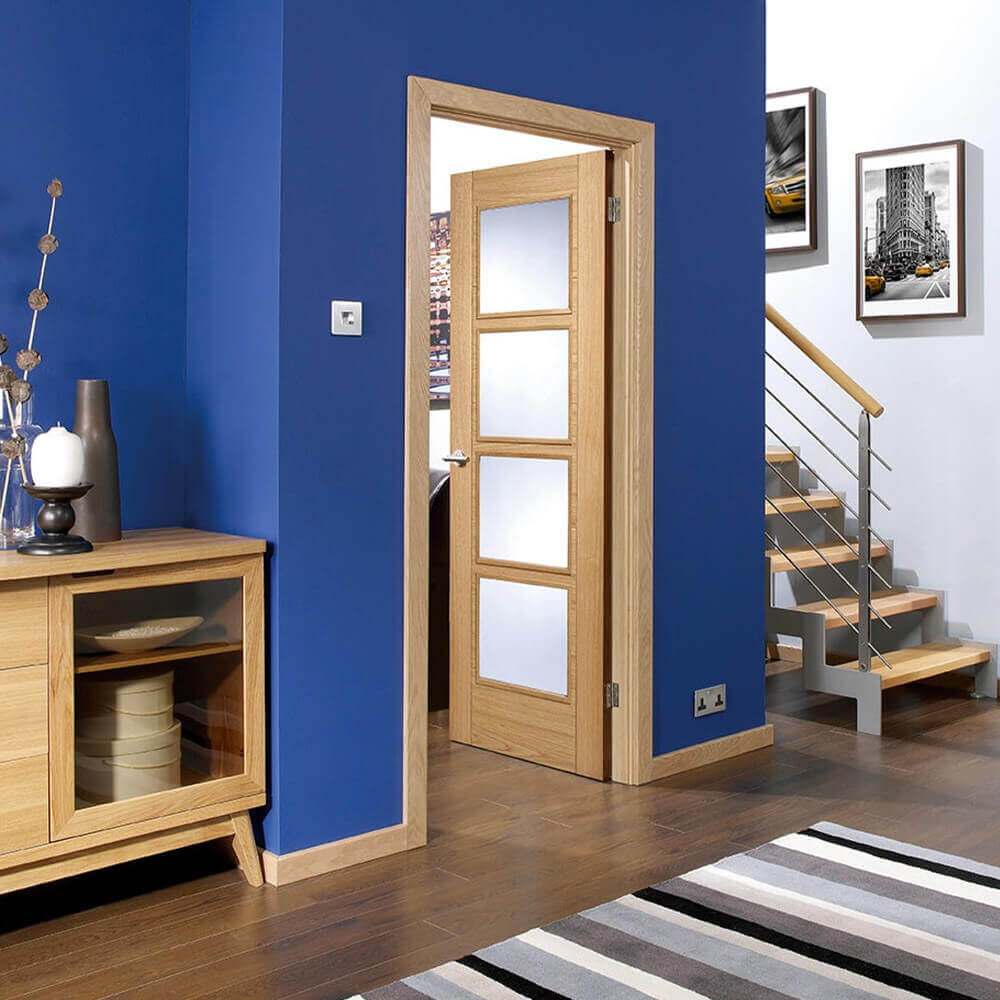 Lifestyle Vancouver prefinished oak four light glazed FD30 fire door installed in a room