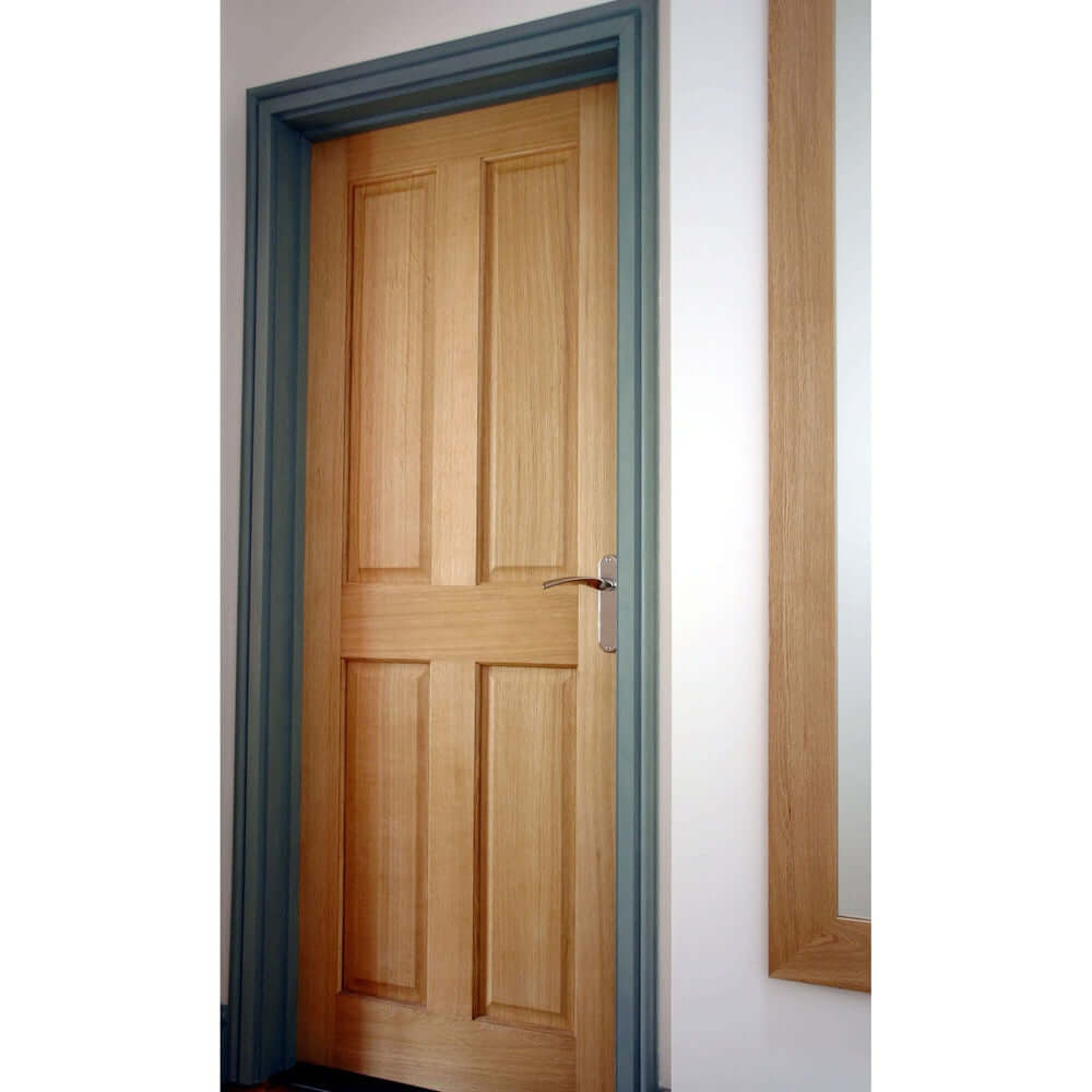 Lifestyle Victorian four panel veneer oak door installed with blue grey frame